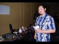 A conference attendee pretends to look interested (at my request) so that I can get a picture.