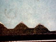 A hand-made key that is easily identifid because of varying slope angles, uneven valleys, and dissimilar cut spacings.