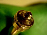 A Vachette VIP nippled pin tumbler that shows signs of picking tools.