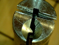 A plug that has been vivisected into three pieces; top and two sides.